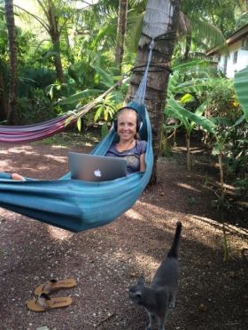 Kristin Wilson working on her laptop in a hammock – Best Places In The World To Retire – International Living